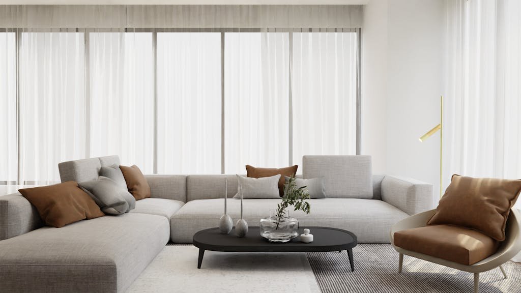 Stylish modern living room with beige sofa, chairs, and minimalist decor, perfect for interior design enthusiasts.